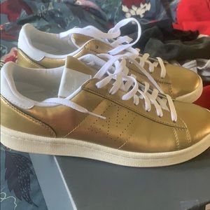 Gold new balance shoes